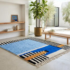 Tapis berbère bleu et motifs graphiques dans salon moderne lumineux décoration bohème chic élégante