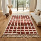 Tapis berbère terracotta à motifs carreaux dans salon lumineux décoration naturelle bohème chic