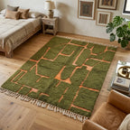tapis berbère vert avec motifs terracotta en relief et franges dans une chambre bohème cosy avec décoration naturelle et bois clair